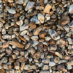 Close-up of 20mm gold flint gravel showcasing natural golden and amber tones